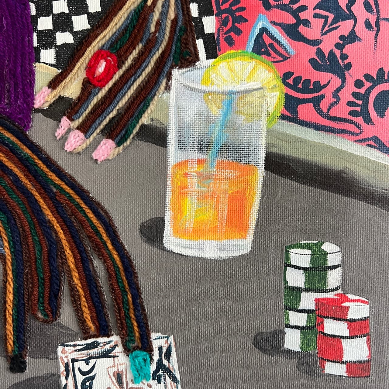 Detail of All In, Still Calm showing a drink, poker chips, and yarn-built hands