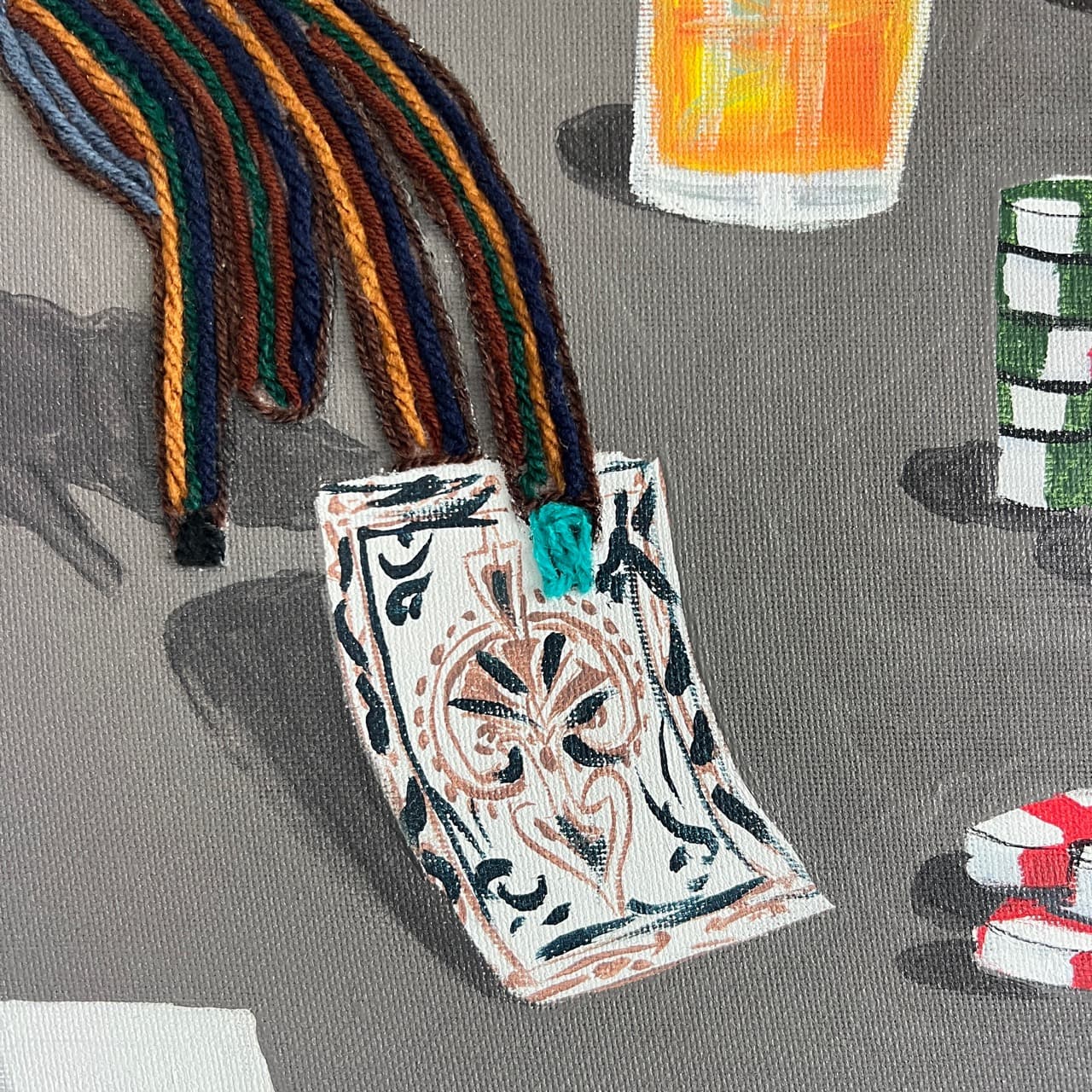 Detail of All In, Still Calm showing a patterned deck of cards, poker chips, and a drink